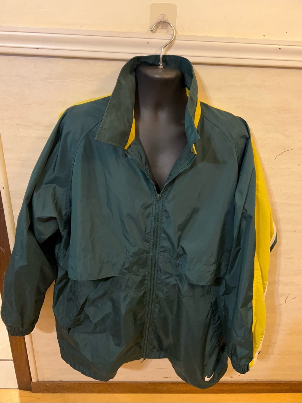 A vintage 1990s Nike full-zip windbreaker track jacket